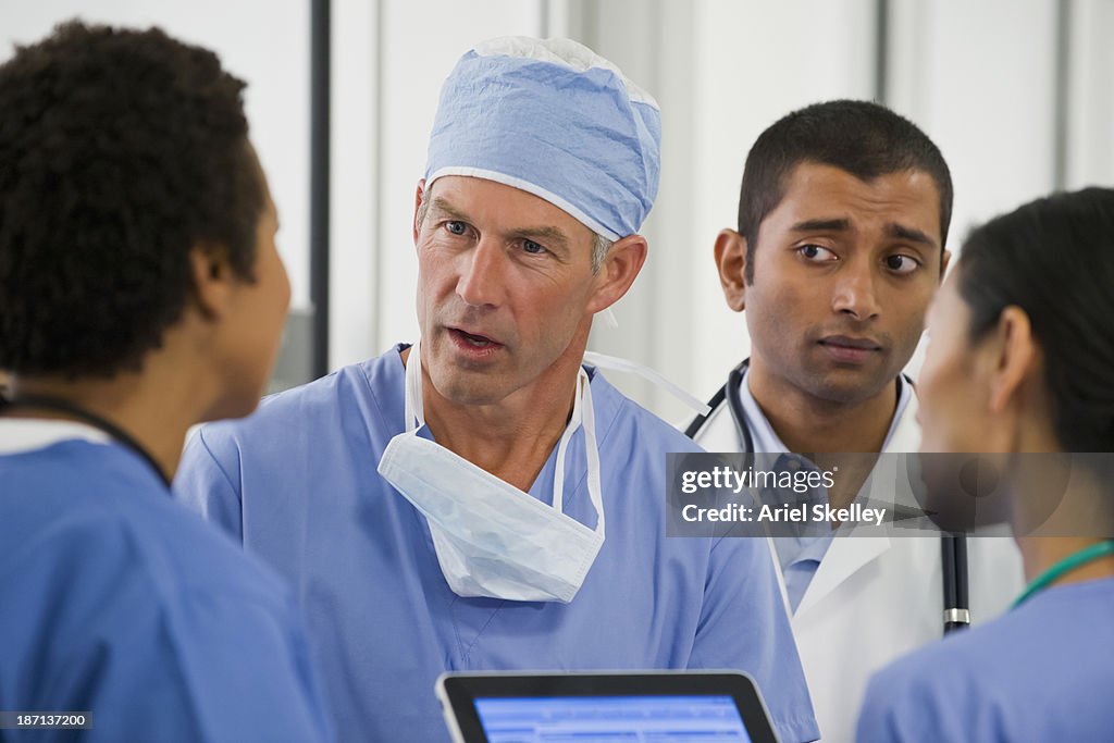 Doctors talking together in hospital
