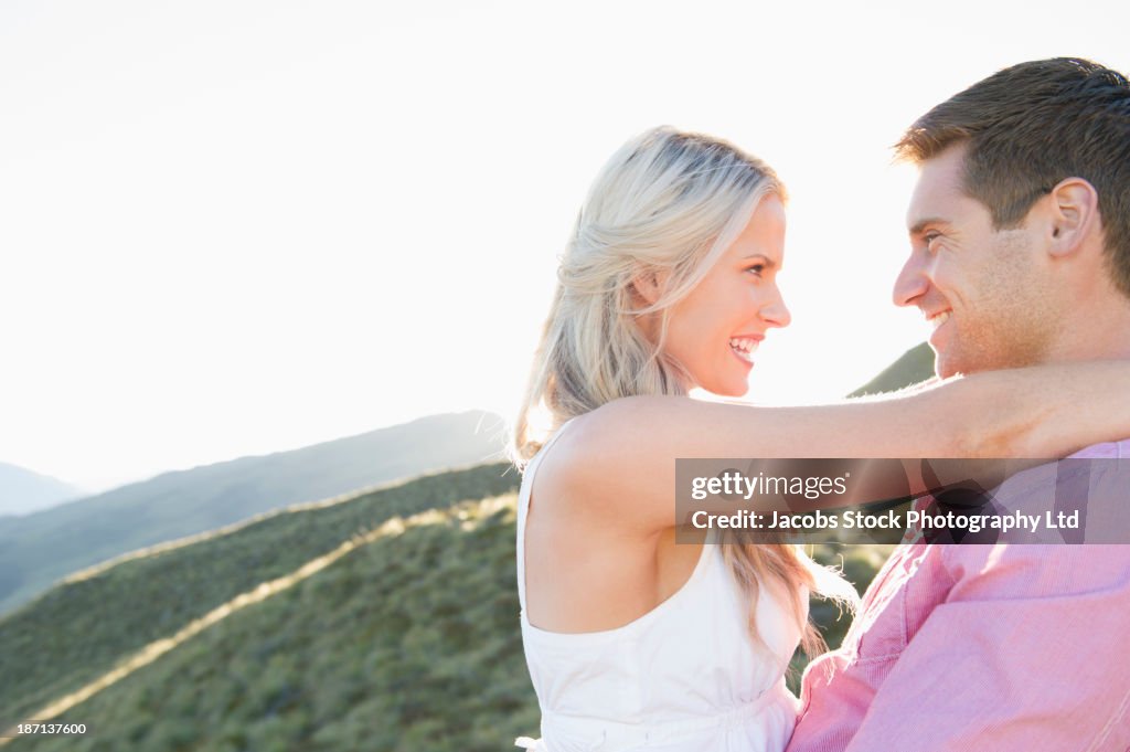 Caucasian couple smiling outdoors