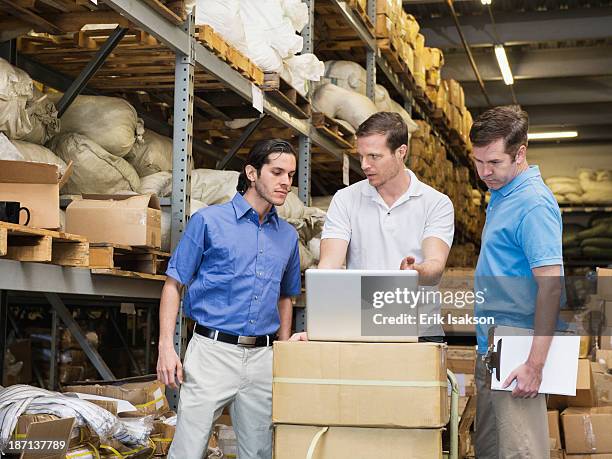Workers Stacking Boxes In Textile Factory, Foto de stock