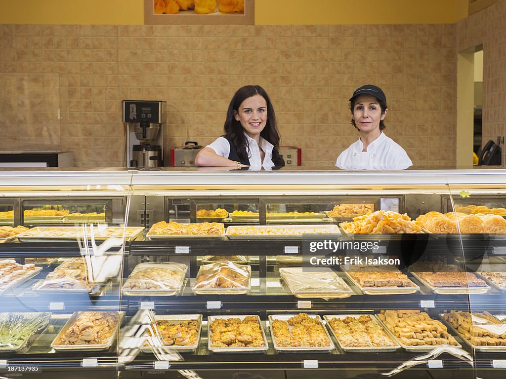 Businesswoman and chef at restaurant counter