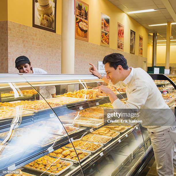 customer ordering at restaurant counter - america patisserie stock pictures, royalty-free photos & images