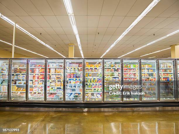 frozen section of grocery store - supermarket refrigeration stock-fotos und bilder