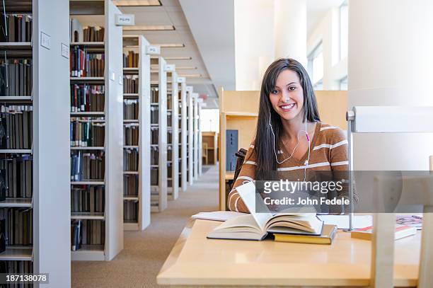 student working at desk in library - saint louis university bildbanksfoton och bilder