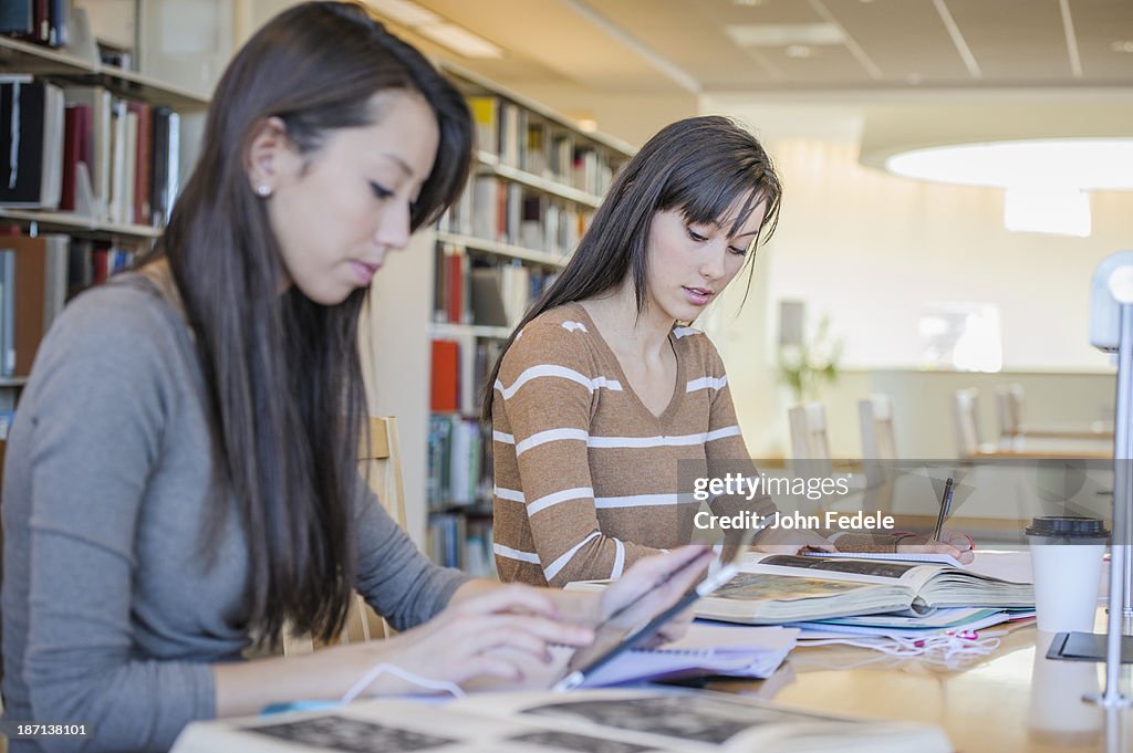 Students working at desk in library