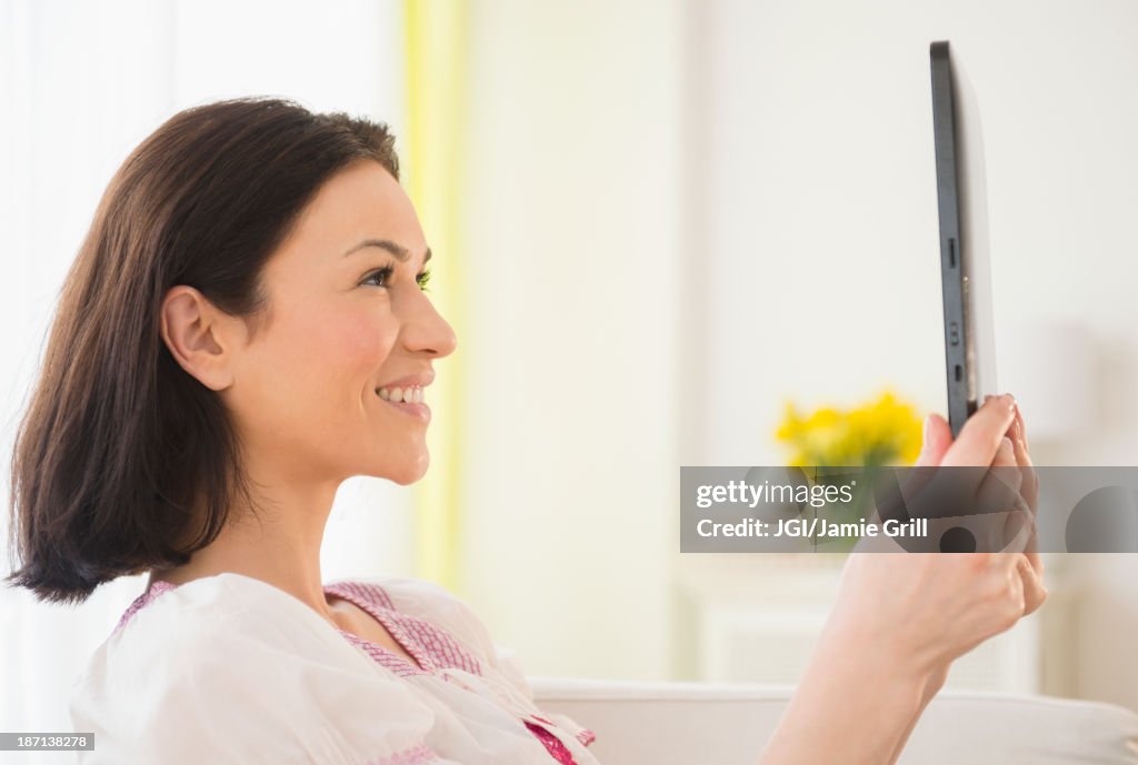 Caucasian woman using tablet computer