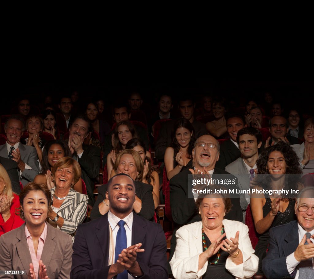 Businesspeople clapping in audience