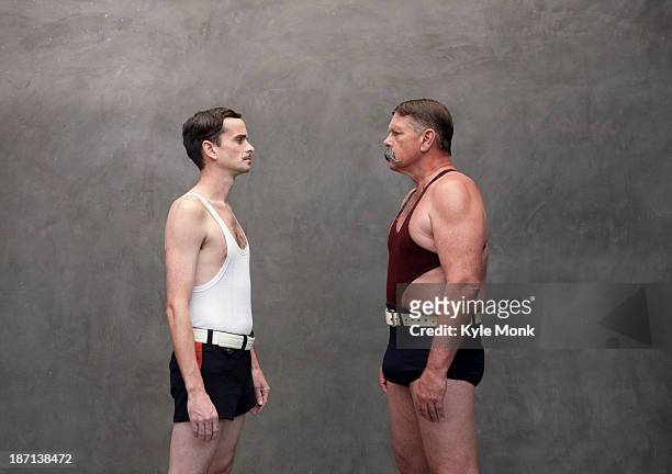 caucasian wrestlers examining each other - strongman foto e immagini stock