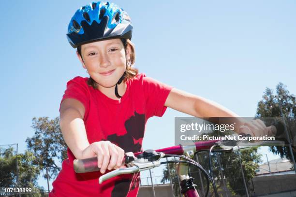 caucasian girl riding bicycle outdoors - british blonde stock pictures, royalty-free photos & images