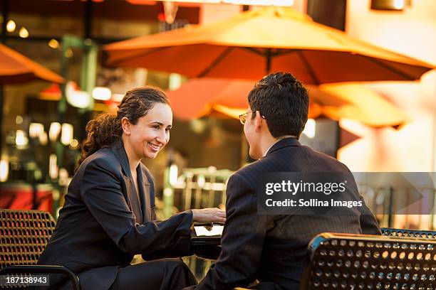 hispanic business people working at cafe - san rafael - california ストックフォトと画像