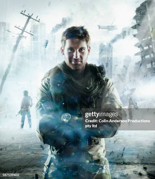 caucasian soldier standing in combat zone - attitude army stock pictures, royalty-free photos & images