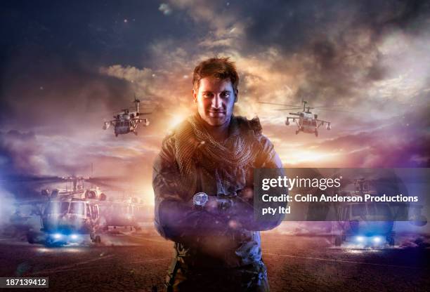 caucasian soldier standing in combat zone - helicopter photos stock pictures, royalty-free photos & images