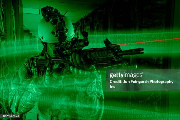 african american soldier holding gun in server room - forças armadas especiais imagens e fotografias de stock