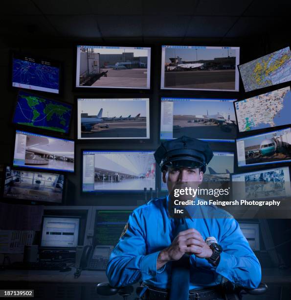 police officer working in control room - gesture control screen stockfoto's en -beelden