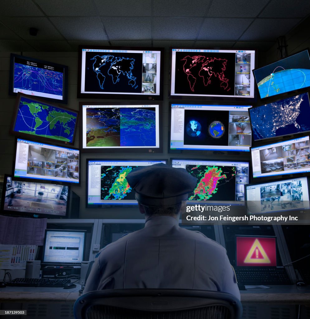 Police officer working in control room