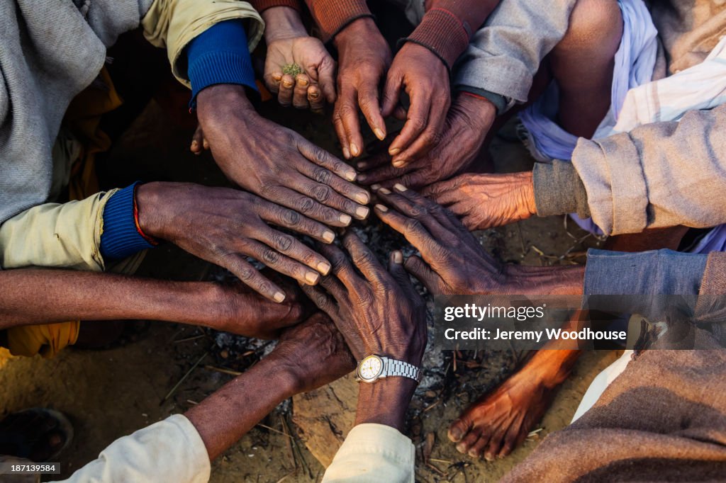 Close up of hands in circle at festival, Allahabad, Uttar Pradesh, India
