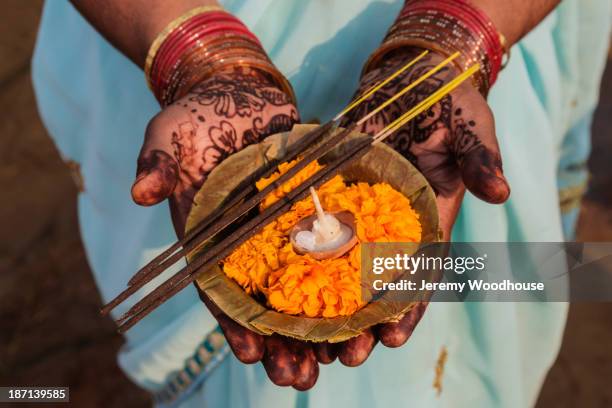 decorated hands holding traditional offering, allahabad, uttar pradesh, india - daily life in allahabad bildbanksfoton och bilder