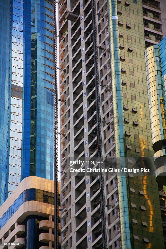 Tall Buildings With Windows And Balconies In An Urban Area