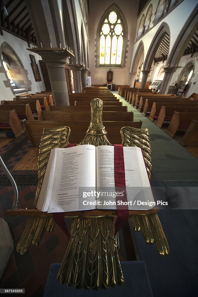 An Open Bible On A Gold Podium In St. Andrew's Church