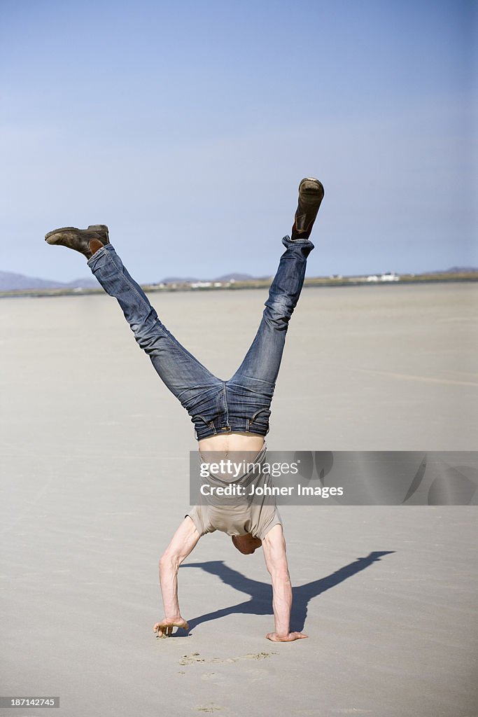 Man doing handstand