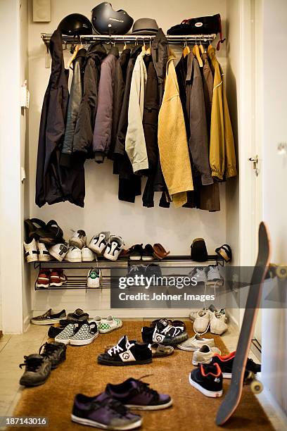 a hall with a lot of shoes - schuhständer stock-fotos und bilder