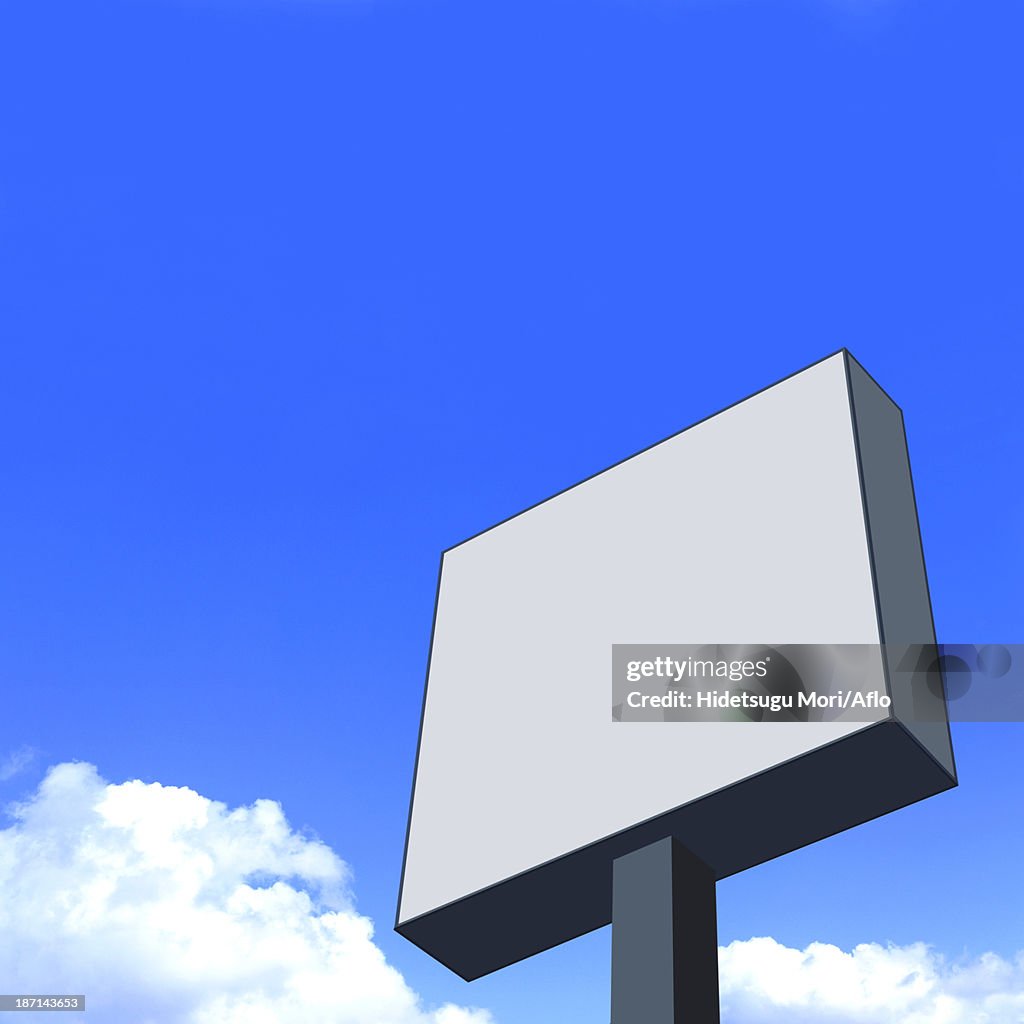 Outdoor sign and sky with clouds