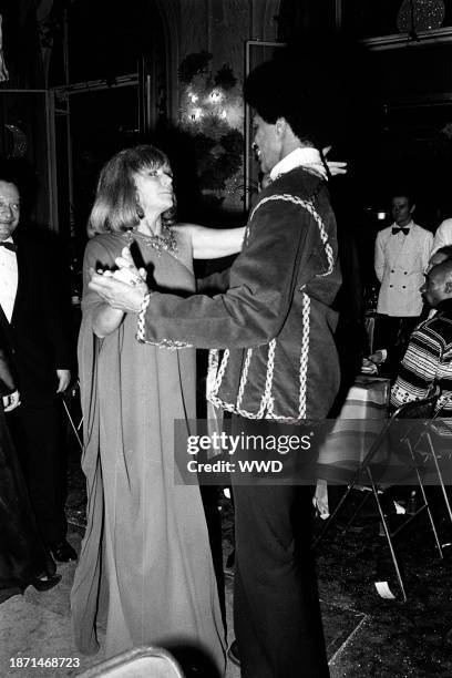 Bettina and friend attend the premiere of the Alvin Ailey dance group, hosted by ex-ambassador Sargent Shriver and his wife Eunice at the Palais des...