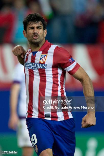 Diego Costa celebrates scoring their fourth goal during the UEFA Champions League group G between Club Atletico de Madrid and FK Austria Wien at...