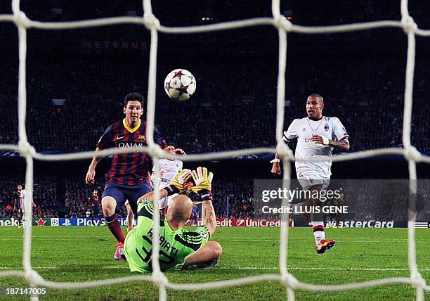 Barcelona's Argentinian forward Lionel Messi scores during the UEFA Champions league football match FC Barcelona vs AC Milan at the Camp Nou stadium...