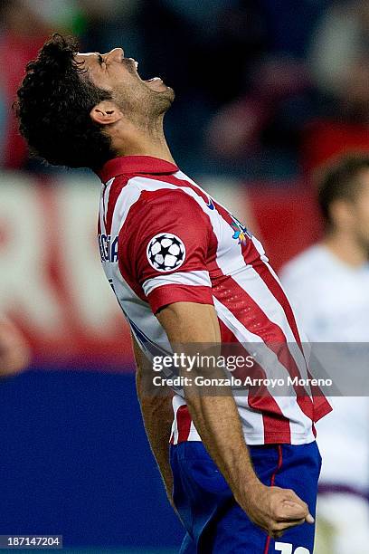 Diego Costa celebrates scoring their fourth goal during the UEFA Champions League group G between Club Atletico de Madrid and FK Austria Wien at...