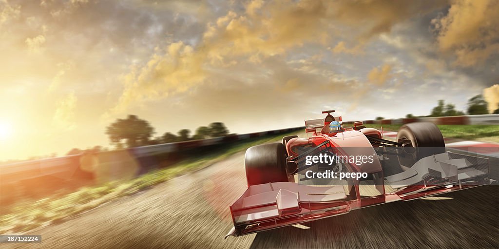 Racing Car At Speed In Summer Sunset