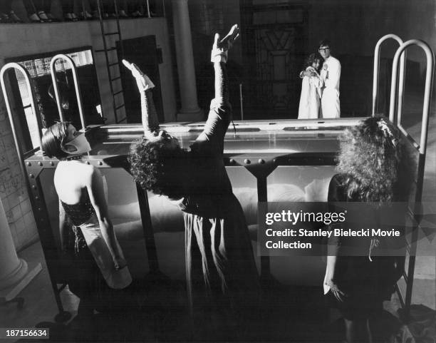 Actors Susan Sarandon, Barry Bostwick, Little Nell, Tim Curry and Patricia Quinn, in a scene from the movie 'The Rocky Horror Picture Show', 1975.