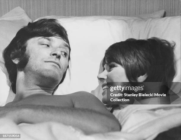 Actors Judy Carne and Tom Bell in a scene from the film 'All The Right Noises', 1971.