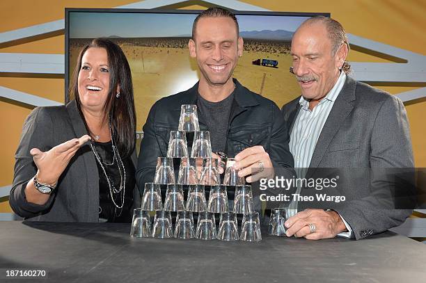 Personalities Ashley Broad, Seth Gold, and Les Gold participate at the Guinness World Records Unleashed Arena in Times Square on November 6, 2013 in...