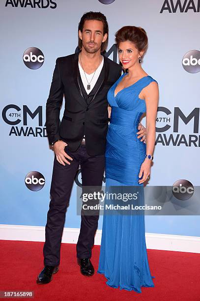 Jake Owen and wife Lacey Buchanan attend the 47th annual CMA Awards at the Bridgestone Arena on November 6, 2013 in Nashville, Tennessee.