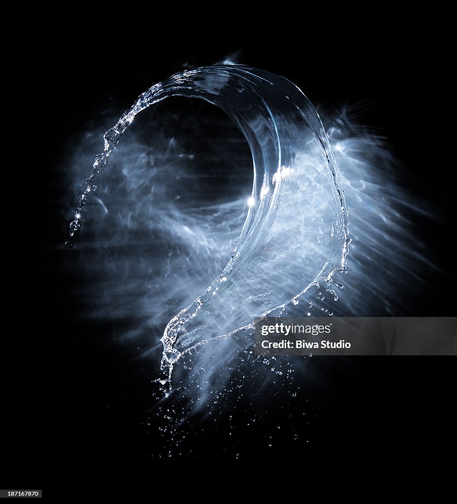 Water splash in midiar with lighting reflection