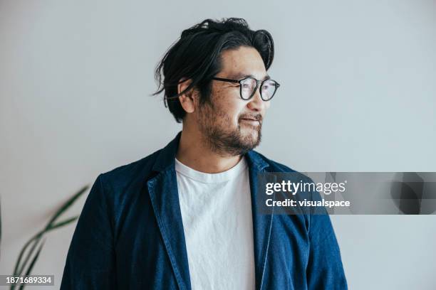 portrait of contemplating japanese therapist - looking away stock pictures, royalty-free photos & images