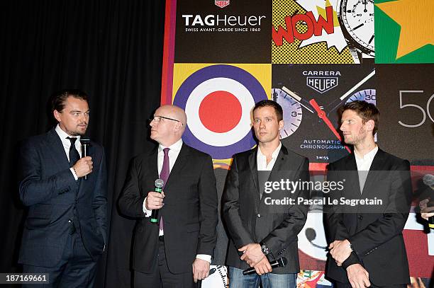 Leonardo DiCaprio, TAG Heuer's CEO Stephane Linder, Sebastien Ogier and Romain Grosjean speak on stage during the Opening of the TAG Heuer New...