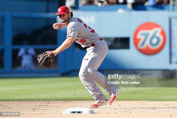 Pete Kozma of the St. Louis Cardinals throws the ball to first base during Game Five of the National League Championship Series against the Los...