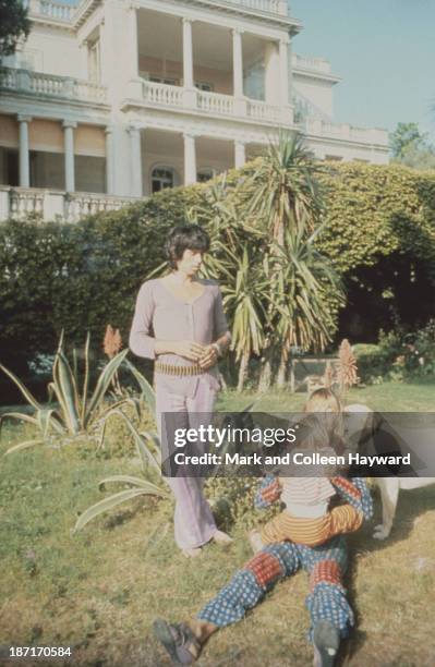 Keith Richards from The Rolling Stones posed with Anita Pallenberg and child, circa 1970.