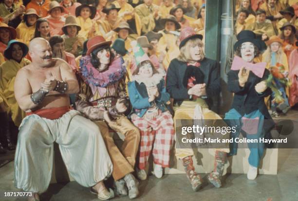 Bill Wyman and Brian Jones from The Rolling Stones, with various clowns and entertainers on the set of the Rolling Stones Rock and Roll Circus at...