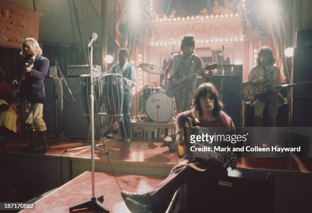 The Rolling Stones perform live on stage on the set of the Rolling Stones Rock and Roll Circus at Intertel TV Studio in Wembley, London on 11th...