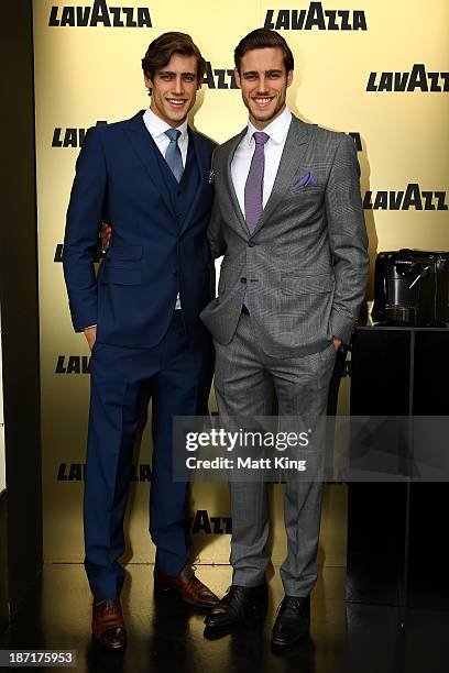Models Zac and Jordan Stenmark pose outside the Lavazza Marquee during Oaks Day at Flemington Racecourse on November 7, 2013 in Melbourne, Australia.