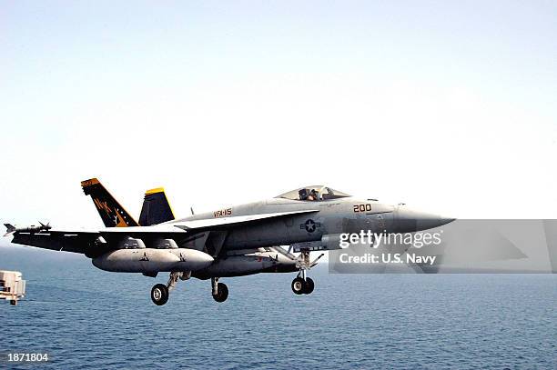 An F/A 18E Super Hornet assigned to the "Eagles" Strike Fighter Squadron One One Five clears the flight deck during combat flight operations aboard...