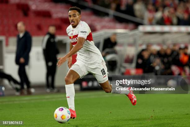 Jamie Leweling of VfB Stuttgart runs with the ball during the Bundesliga match between VfB Stuttgart and FC Augsburg at MHPArena on December 20, 2023...