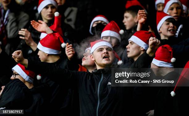 Motherwell fans wear Santa hats during a cinch Premiership match between Motherwell and Rangers at Fir Park, on December 23 in Motherwell, Scotland.