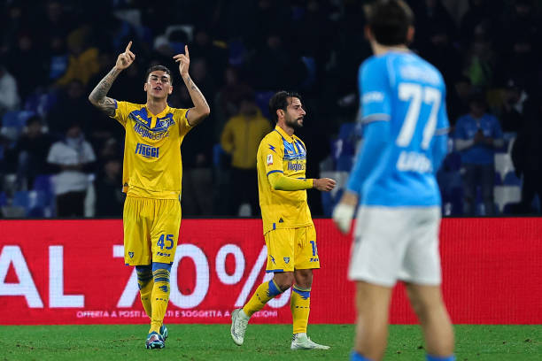 Enzo Barrenechea of Frosinone celebrates with team mates after scoring the goal of 0-1 during the Italy Cup football match between SSC Napoli and...