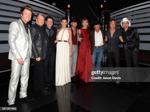 Joe Don Rooney, Gary LeVox, Jay DeMarcus, Faith Hill, Tim McGraw, Taylor Swift, George Strait, Keith Urban and Brad Paisley pose backstage at the...