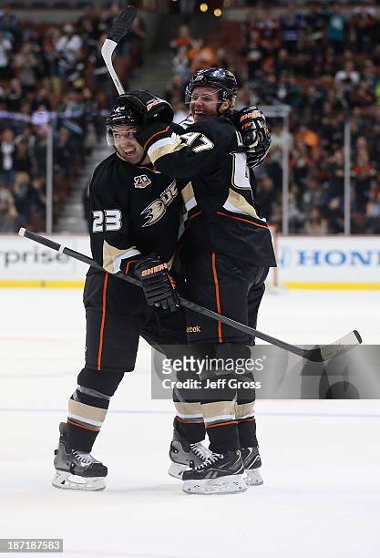 Francois Beauchemin and Hampus Lindholm of the Anaheim Ducks celebrate Lindholm's first NHL goal in the first period against the Phoenix Coyotes at...