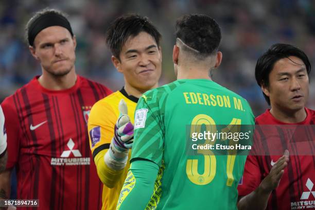 Shusaku Nishikawa of Urawa Red Diamonds and Ederson of Manchester City shake hands prior to the FIFA Club World Cup between Urawa Red Diamonds and...