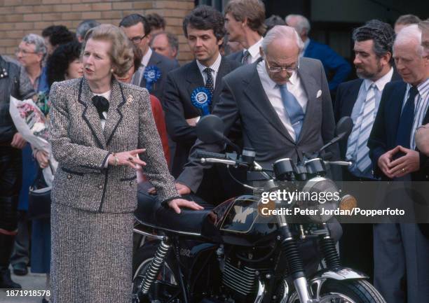 British Prime Minister Margaret Thatcher with her husband Denis campaigning prior to the General Election at the Triumph motorcycle factory in Newton...